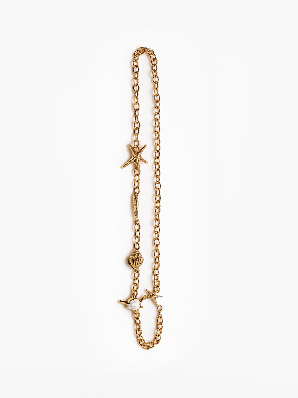 Gold tone chain belt featuring delicate ocean inspired charms, starfish, seashell details