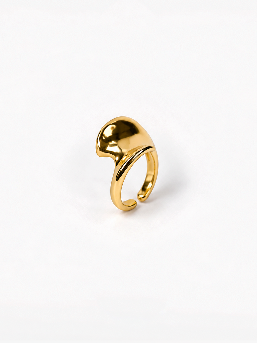 A polished gold-tone adjustable ring with a sculptural, organic curved top, photographed on a seamless white background.