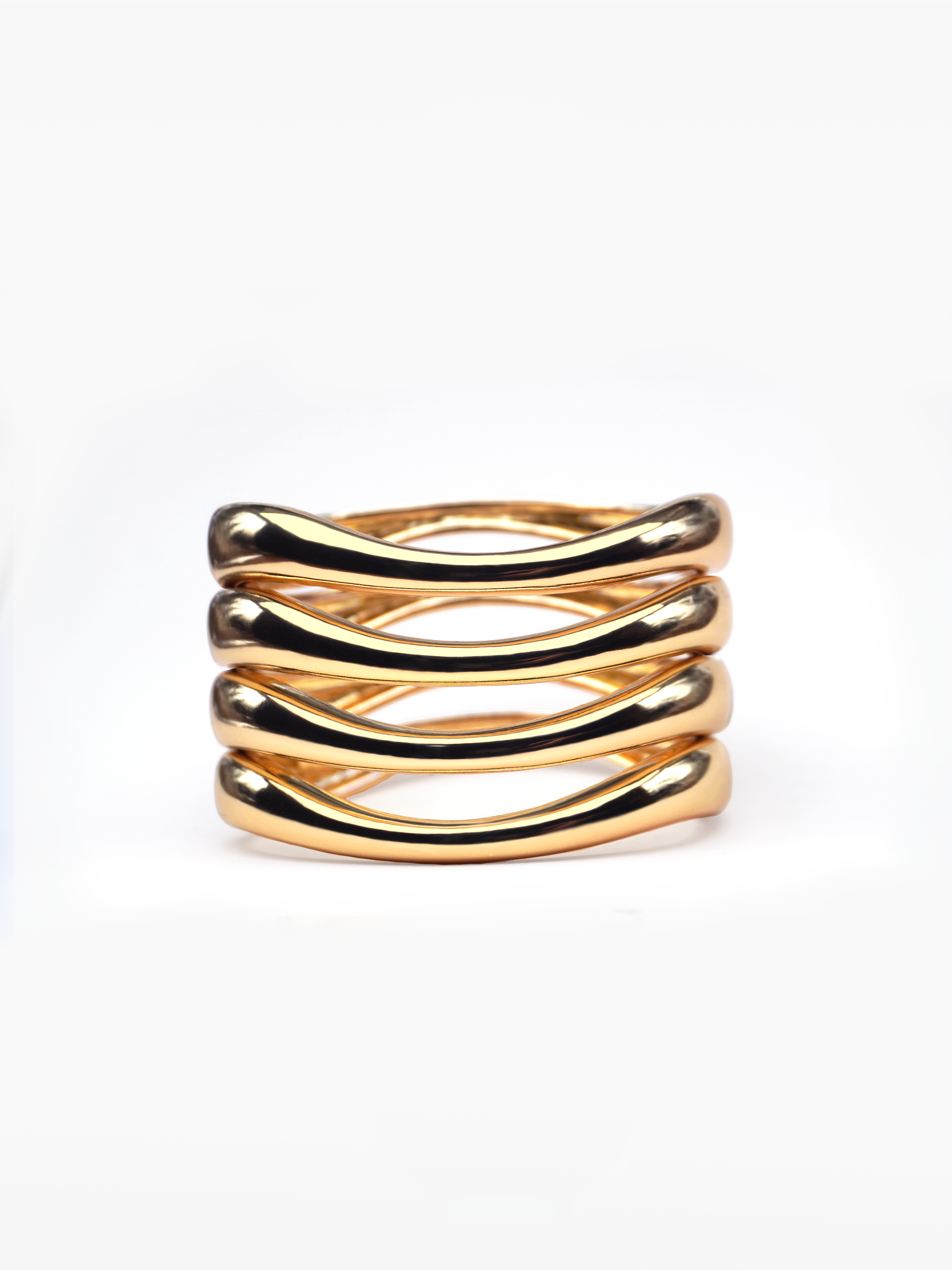 Stack it up bracelets - four gold curved bangles, stackable bangles, twisted gold bangles, wardrobe basics, basic gold jewellery, chunky gold bangles by SOLÉITE