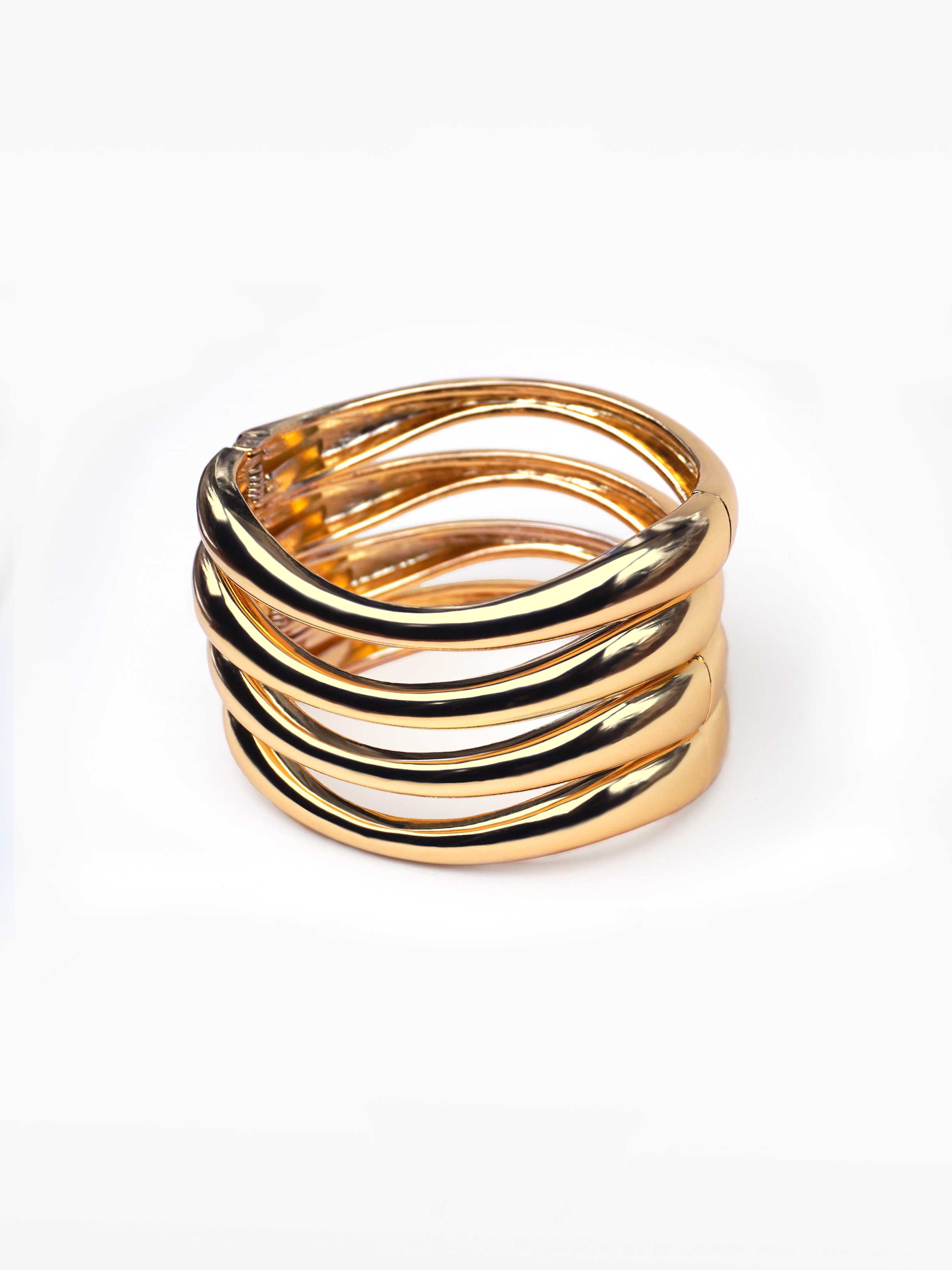 Stack it up bracelets - four gold curved bangles, stackable bangles, twisted gold bangles, wardrobe basics, basic gold jewellery, chunky gold bangles by SOLÉITE